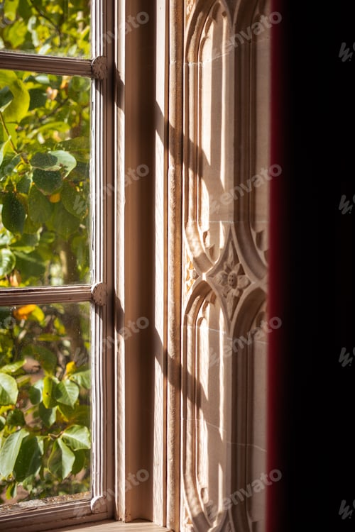 Preview: Sunlight through ornate window casting shadows