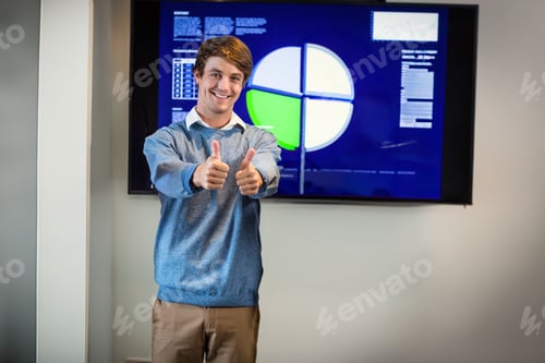 Preview: Man giving thumbs up in conference room, presenting pie chart on wall-mounted display