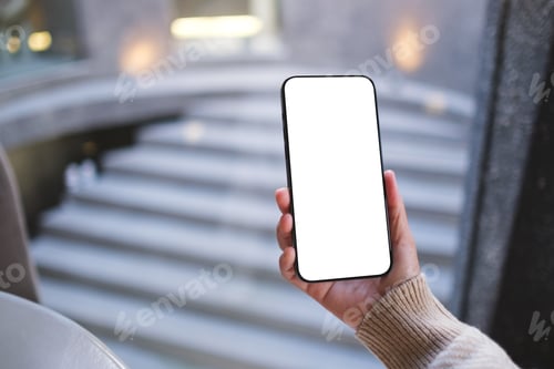 Preview: Mockup image of a woman holding and using mobile phone with blank desktop screen in cafe