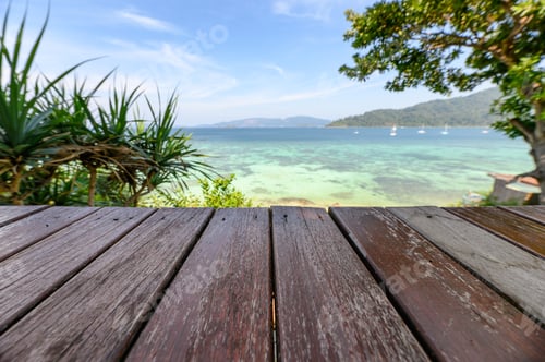 Preview: Wooden tabletop on tropical sea in summer