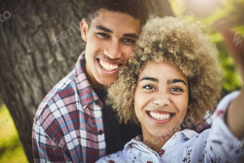 Preview: Shes the one who has my heart. Shot of an affectionate couple spending the day at the park.