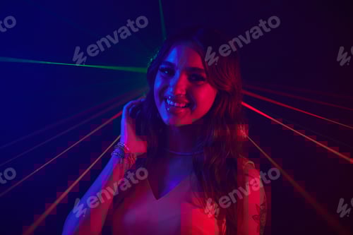 Preview: Young Woman Dancing in Neon Lights
