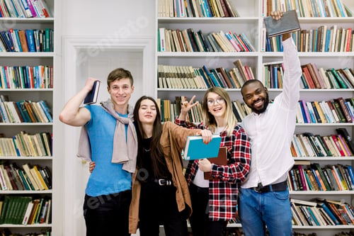 Preview: Students in library, happy learning and education. Young people with books in library are studying