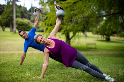 Preview: Man and woman exercising with kettlebell
