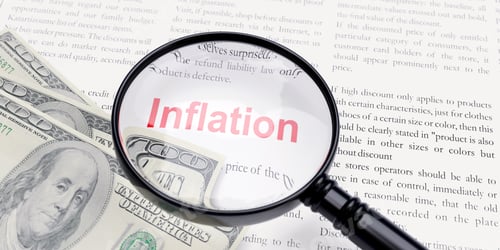 Preview: Inflation word and US dollar banknote. Global Economic crisis concept.