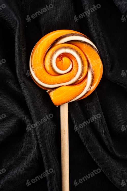 Preview: orange and black lollipop