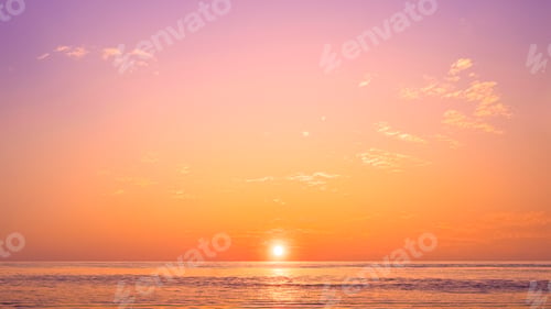 Preview: Romantic sunset sky background over sea with golden sunlight reflection on water surface