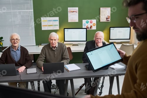Preview: Senior Caucasian Men Attending Computer Literacy Course in Classroom Setting