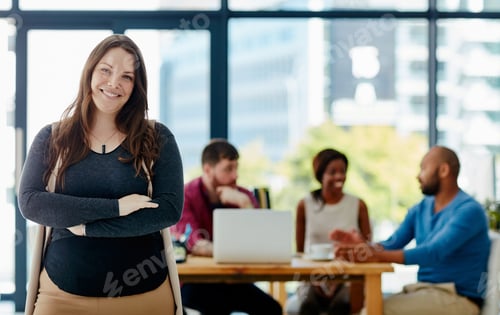 Preview: Cropped portrait of a young female designer standing in the office