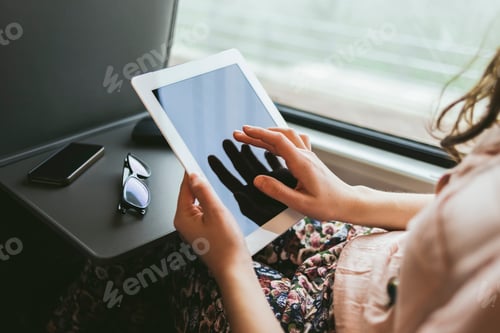 Preview: Woman using a digital tablet