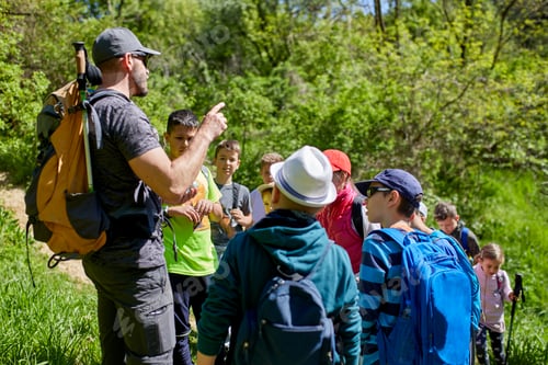 Preview: Man talking to kids on a field trip on trail