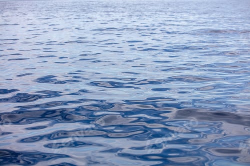 Preview: Sea water surface calm with small ripple. Still ocean, deep blue color background. Aegean Sea.