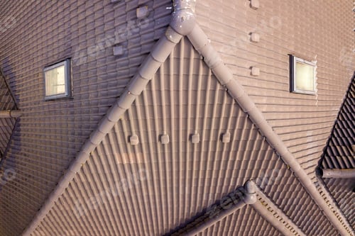 Preview: Closeup of house roof top covered with ceramic shingles. Tiled covering of building