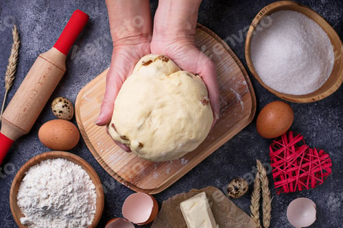 Preview: Female hands knead the dough. Backing concept