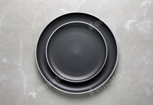 Preview: New dark plates on light grey table, top view