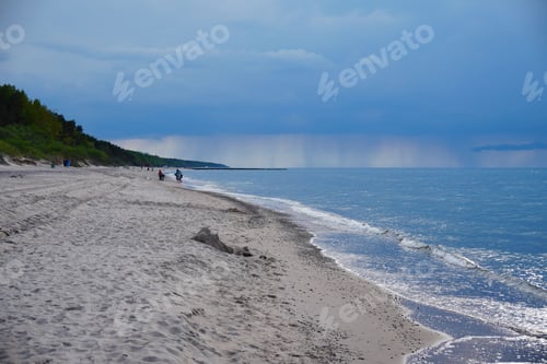 Preview: Beautiful view of a sandy beach with forest in the background in Pobierowo, Poland