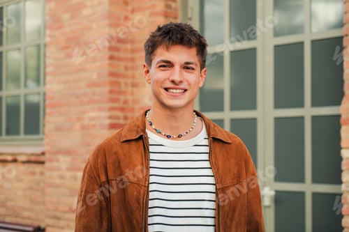 Preview: Horizontal individual portrait of a popular schoolboy looking at camera standing at high school