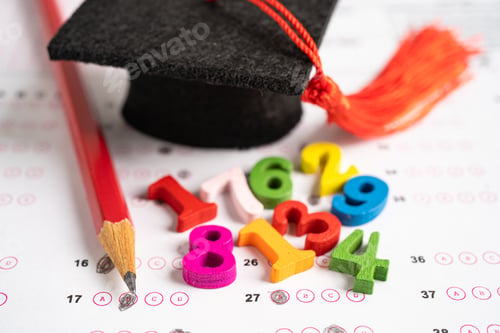 Preview: Graduation gap hat and pencil on answer sheet paper, Education study testing learning teach concept.