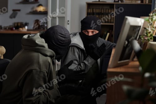 Preview: Two Men Wearing Masks Planning Robbery Indoors at Night