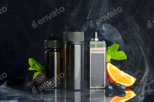 Preview: Vape and smoking liquid with fruit against black background with smoke