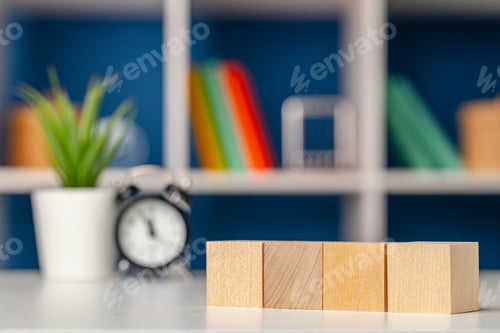 Preview: Four wooden cubes with copy space and alarm clock