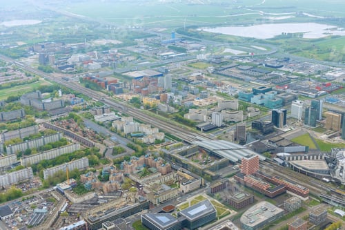 Preview: City Amsterdam skyline seen from an aerial view in cloudy weather is composed a panorama of over