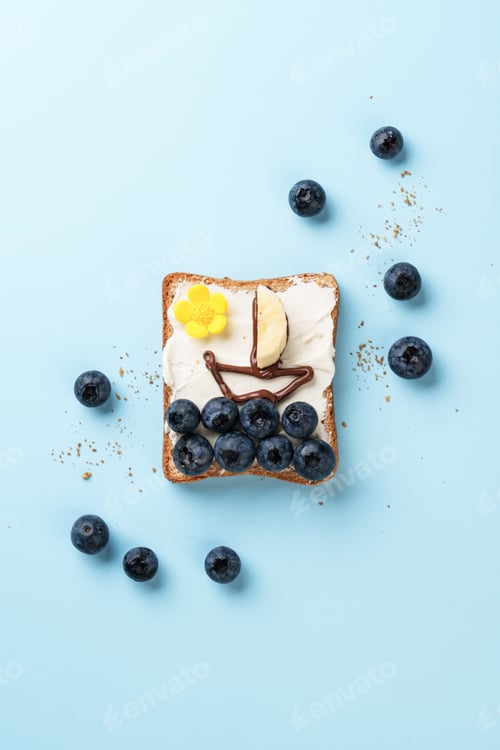 Preview: Open sandwich with funny pictures on it.