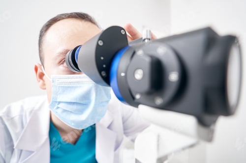 Preview: Professional doctor using biomicroscope in the hospital