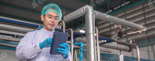 Preview: Worker Checking quality or checking stock of glass bottle in beverage factory.