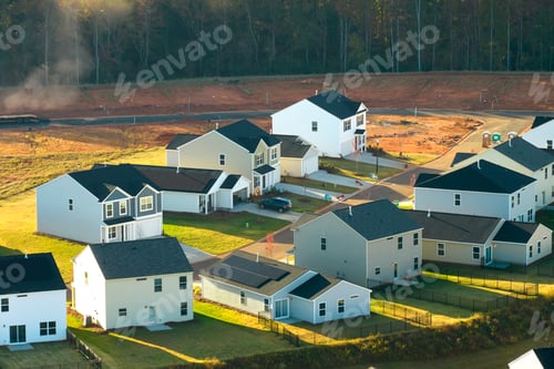 Preview: View from above of densely built residential houses under construction