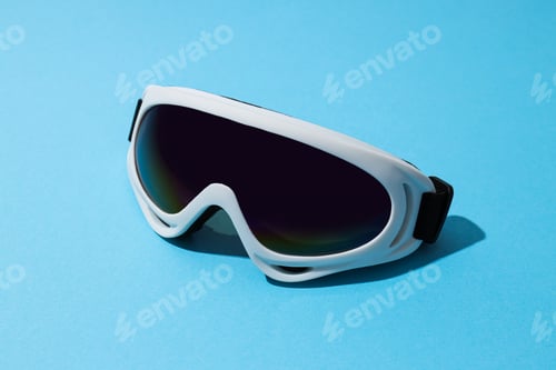 Preview: White ski goggles on a blue background