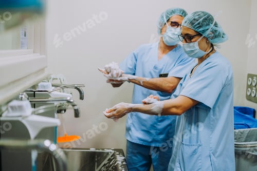 Preview: Unrecognizable doctor washing hands before operating