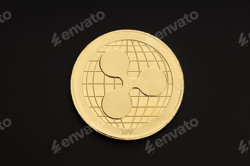 Preview: Ripple coin isolated on black background. Cryptocurrency. Top view