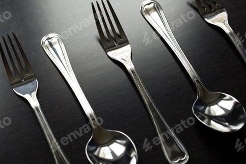 Preview: Cutlery on a black background. Fork, spoon, knife.