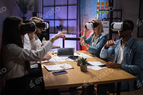 Preview: Multi ethnic company workers using VR glasses on meeting
