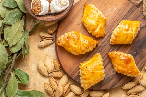 Preview: top view yummy nut cakes with nuts on wooden desk cake biscuit pastry nut