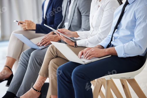 Preview: Unknown group of diverse businesspeople waiting for interview and using technology. Team of applica