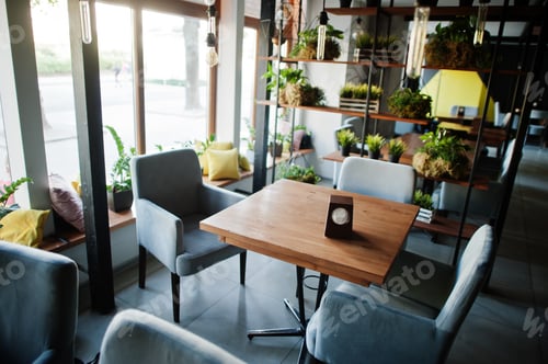 Preview: Chairs and table in modern cafe interior.