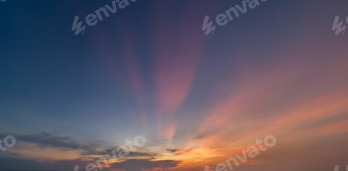 Preview: Sunset sky. Abstract nature background. Dramatic blue and orange, colorful clouds at twilight time.