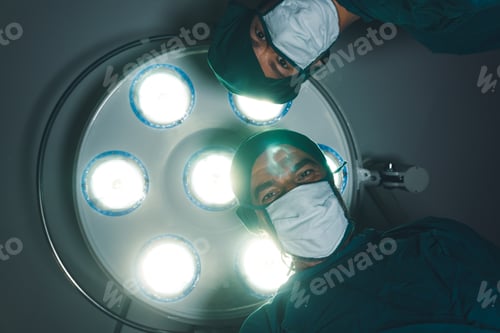 Preview: Surgeons Wearing Masks Under Surgical Lighting
