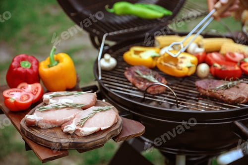 Preview: Modern barbecue grill with fresh products outdoors, closeup
