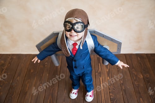Preview: Portrait of young businessman with toy paper wings