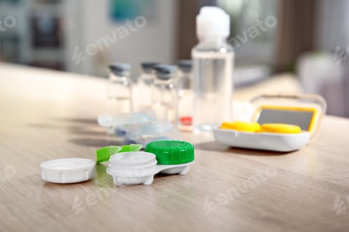 Preview: Contact lens accessories on wooden table