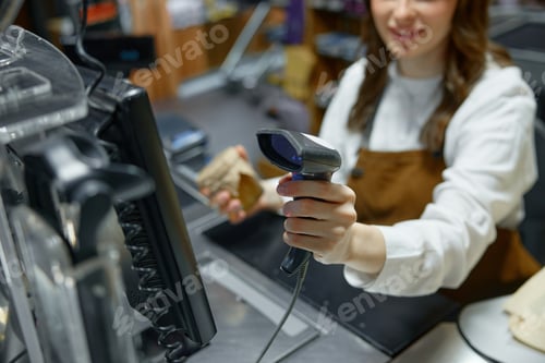 Preview: A woman is actively using a barcode scanner in a retail store