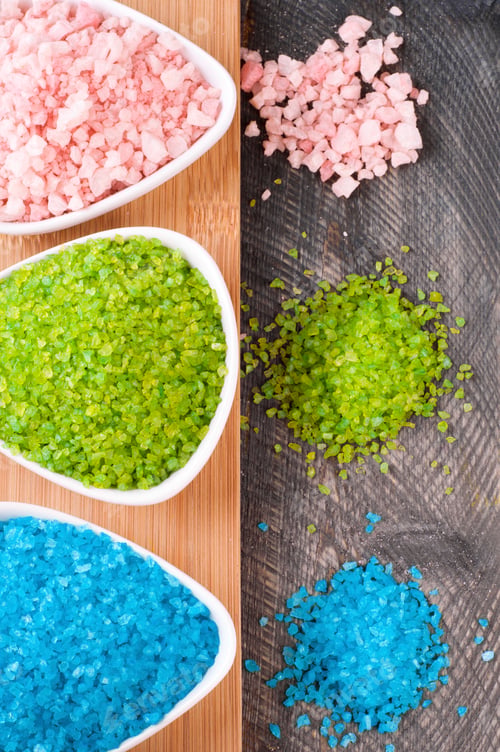 Preview: Blue, green and pink sea salt for spa treatments on old wooden background