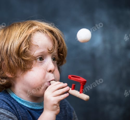 Preview: Excited Boy Plays with Toy Ball and Tube