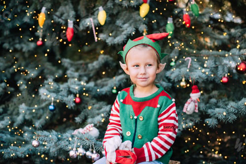 Preview: Christmas in july. Child waiting for Christmas in wood in july.