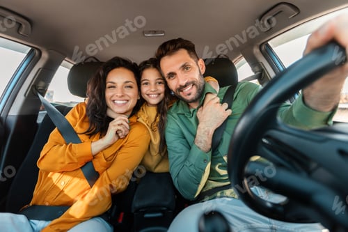 Preview: Automobile rent and purchase. Excited family embracing sitting in new car driving and enjoying road