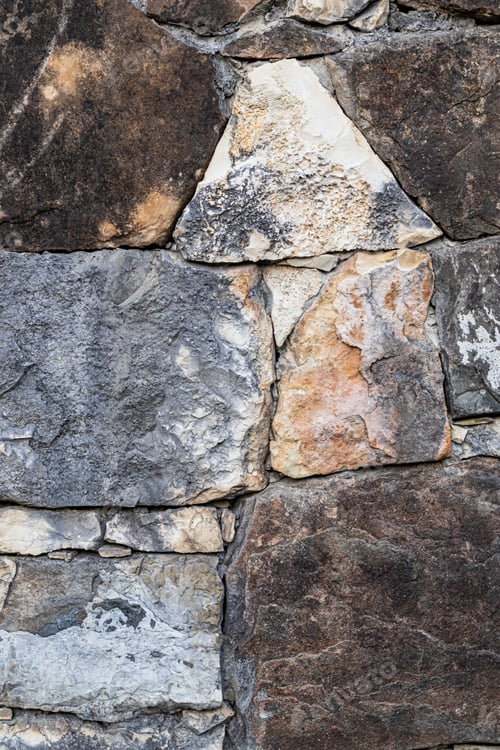Preview: vertical stone background. rough stone pieces are stacked in a row. Layout for building design
