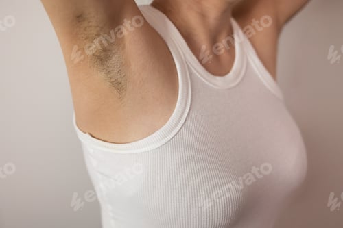 Preview: Unshaven armpits woman in white tank top